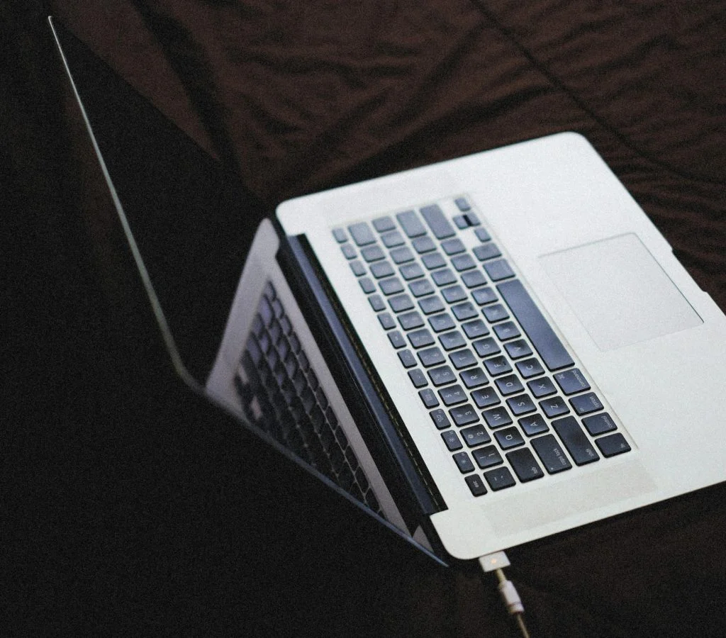 Man comparing laptops at a store