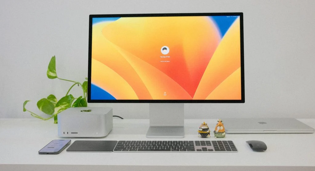 A clean and organized computer setup with a desktop, keyboard, and monitor